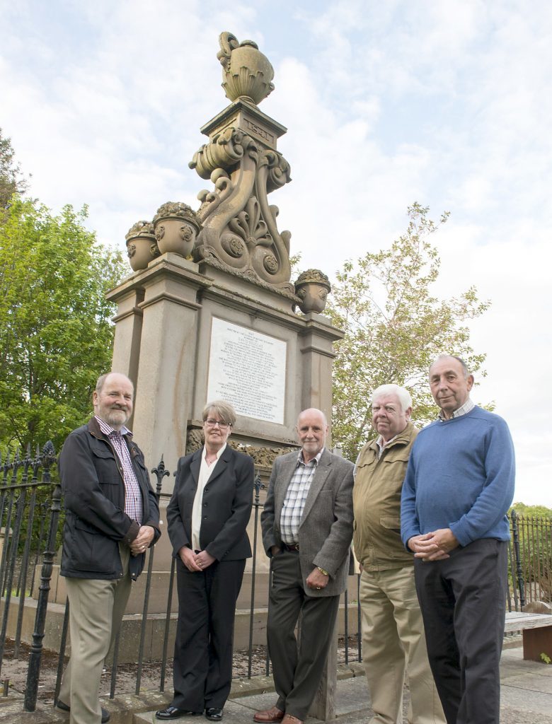 Members of The Scone and District Historical Society with the memorial.