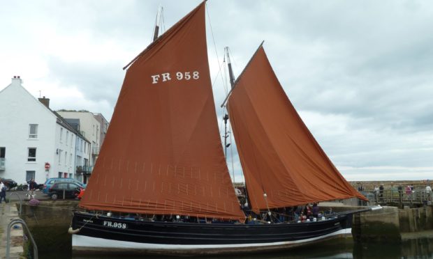 The Reaper heads a 50-strong flotilla back to Anstruther.