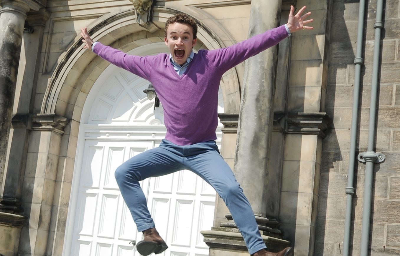 Fashion show director Oscar Macdonald jumps for joy at the £30,000 raised for SANE and its black dog campaign