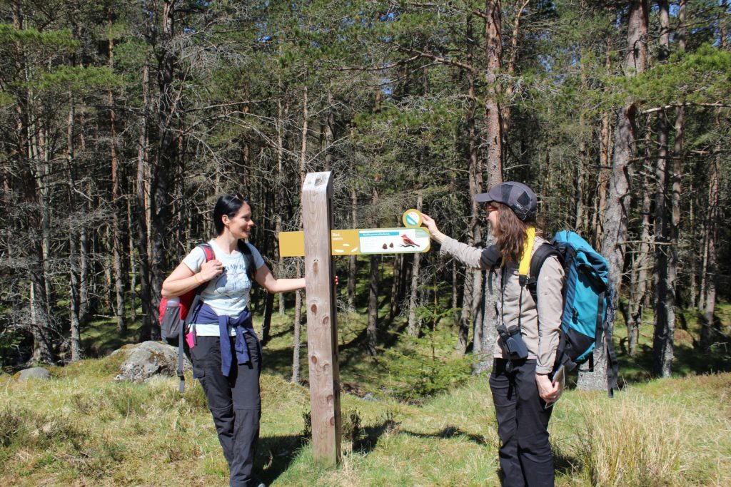 Gayle and Lisa check out a sign in Glen Doll.