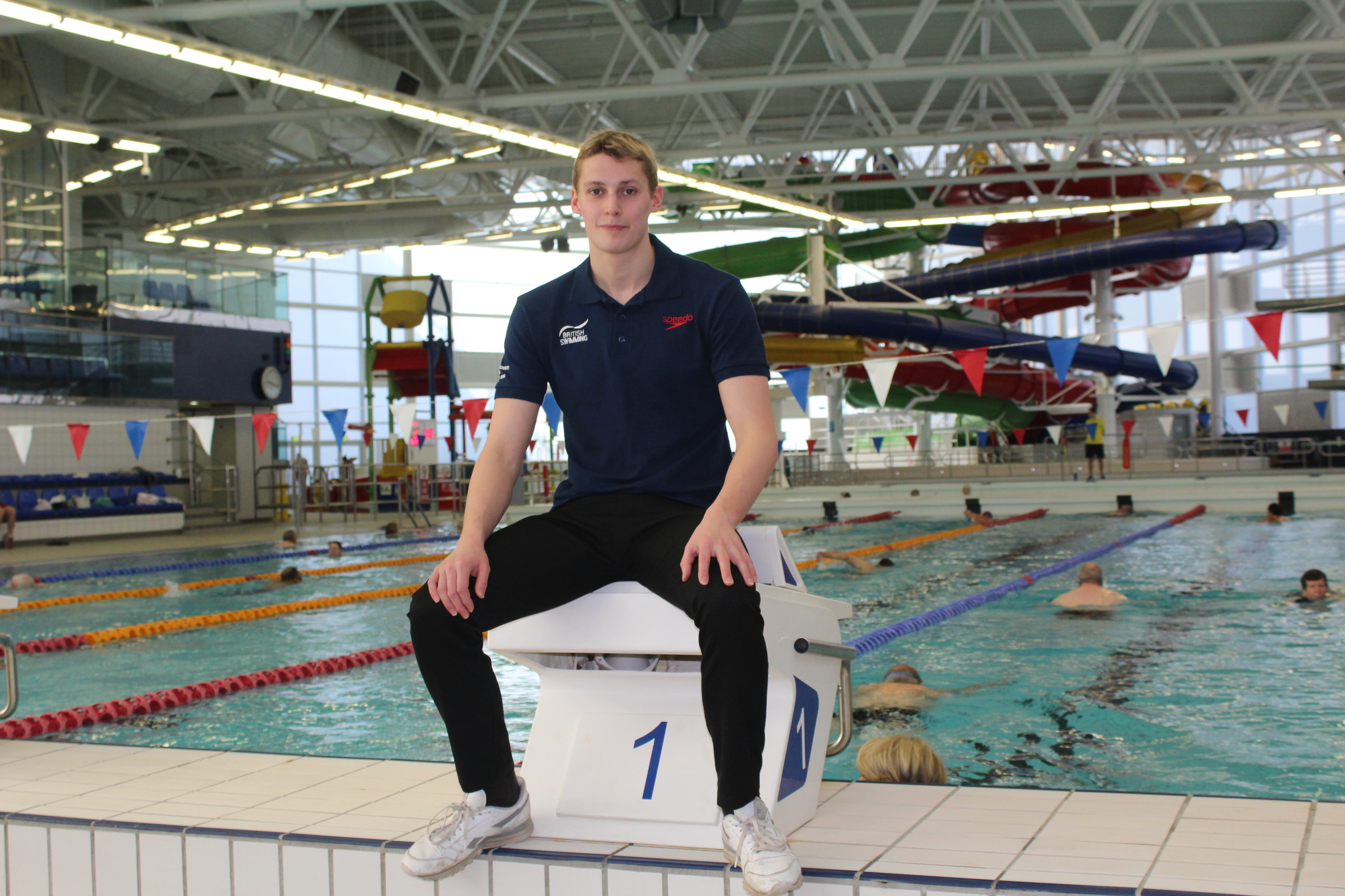 Stephen Milne sitting by the training pool at Olympia