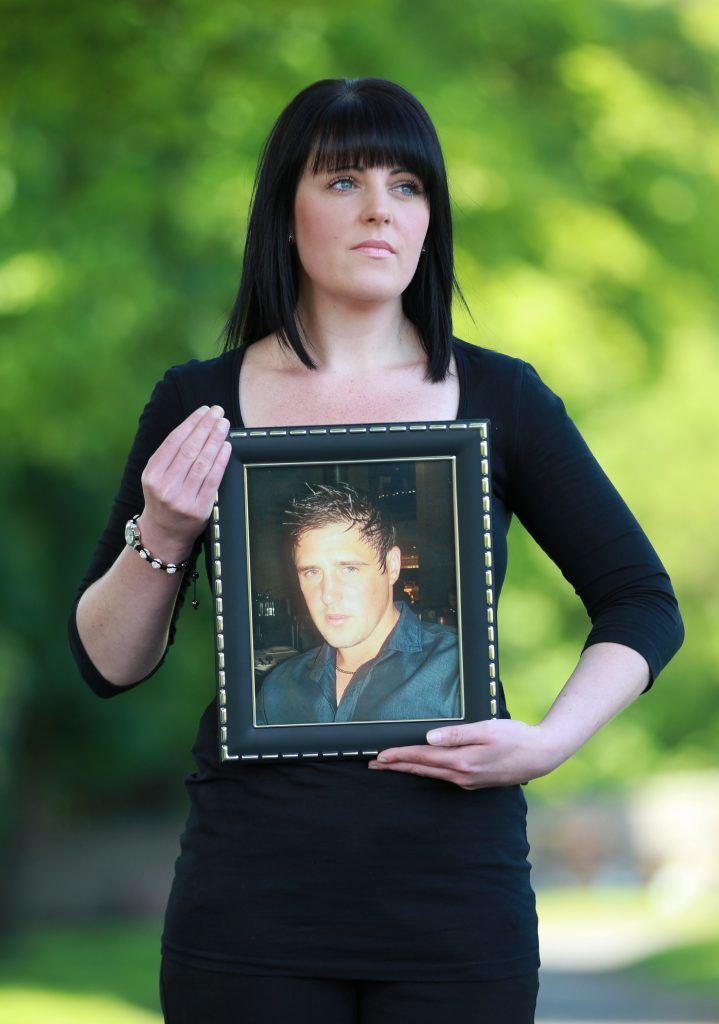  Lisa McLean with a photo of her brother Barry