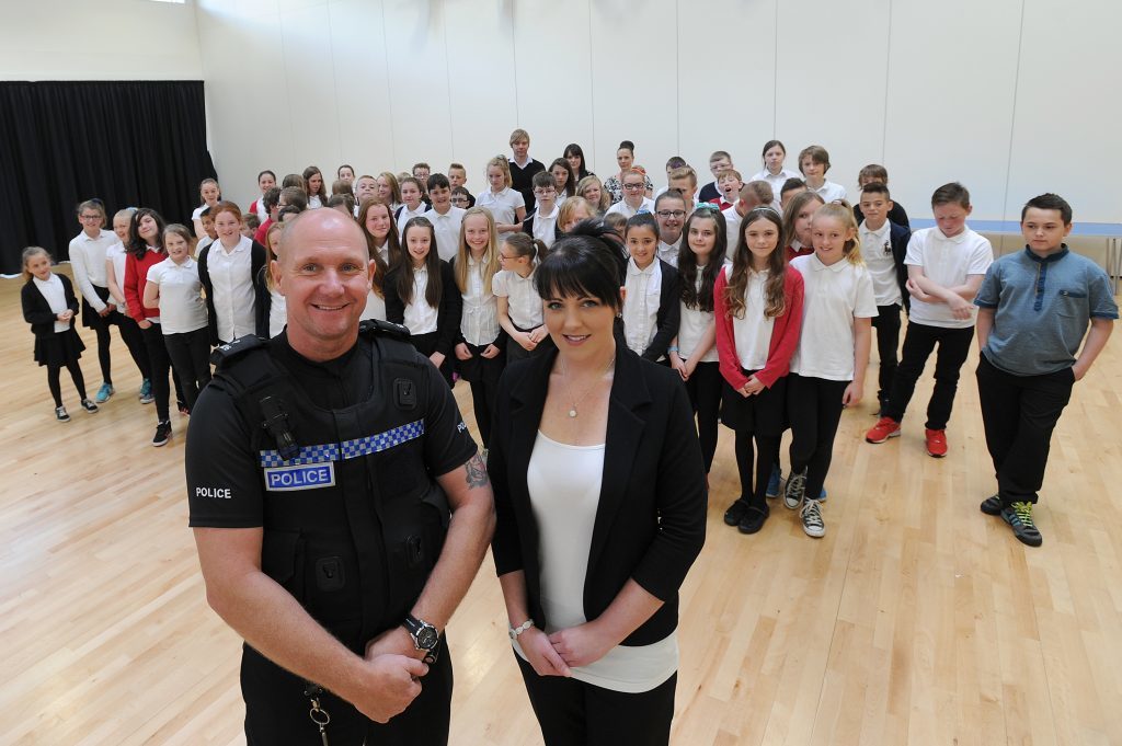 Lisa McLean, sister of Barry McLean, with PC Ross Masterton, giving an anti-knife crime talk to pupils at Burntisland Primary - 