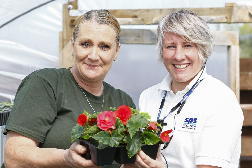 Prisoner Wendy's display of begonias gets the seal of approval from Leanne Hamilton.
