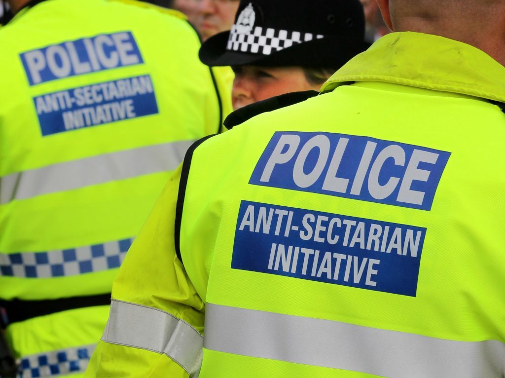 Previously unreleased photo dated 18/09/11 of police wearing Anti-Sectarian Initiative jackets at the Old Firm match between Glasgow Rangers and Glasgow Celtic at Ibrox, Glagow.