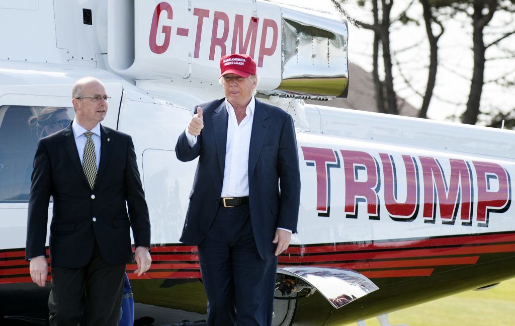 Donald Trump (right) meets Ralph Porciani, resort general manager after arriving by helicopter at his Trump Turnberry golf course in Ayrshire, which is hosting the Ricoh Women's British Open.PRESS ASSOCIATION Photo. Picture date: Thursday July 30, 2015. The 2016 Republican US presidential candidate is on a two-day visit to Scotland. See PA story POLITICS Trump. Photo credit should read: Jane Barlow/PA Wire