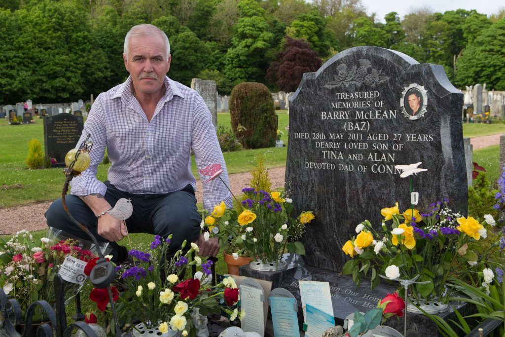 Alan McLean at the grave of his son Barry McLean 