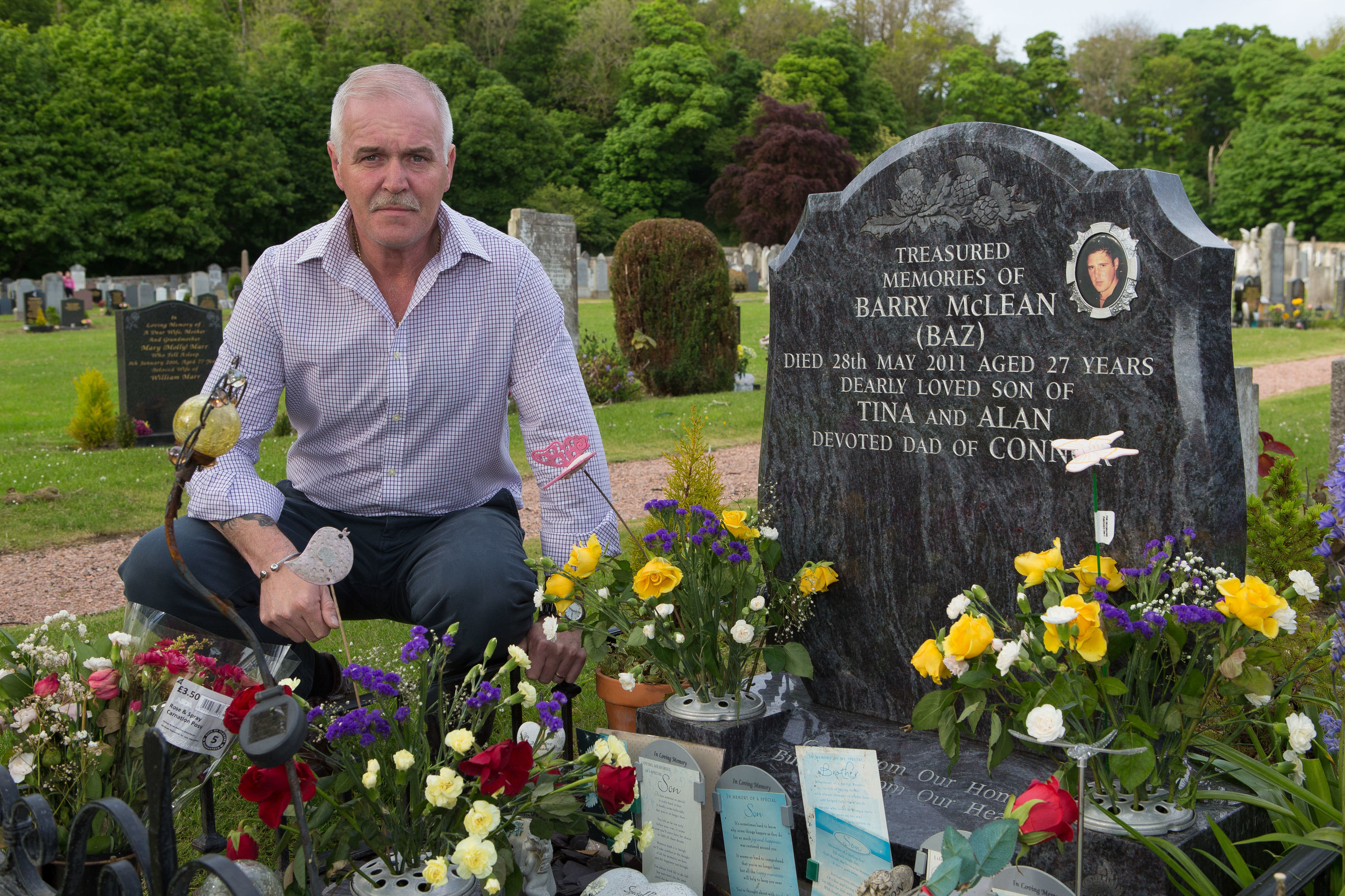 Alan McLean at the grave of his son Barry McLean