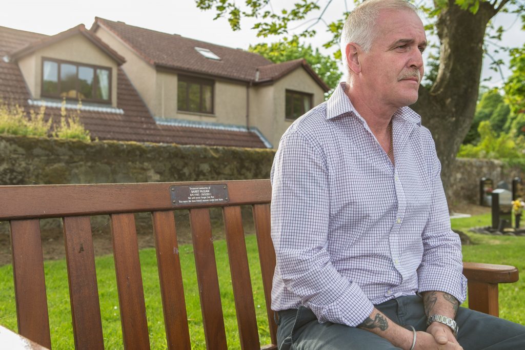 Alan McLean on the bench dedicated to Barry at Burntisland Cemetery