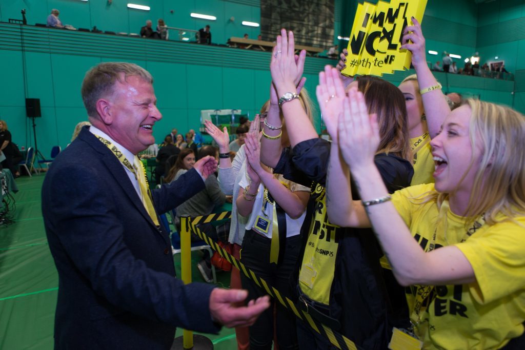 David Torrance celebrates with supporters.