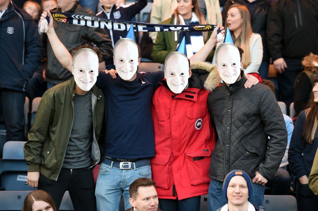 The masks are out in force in the Dundee stands.