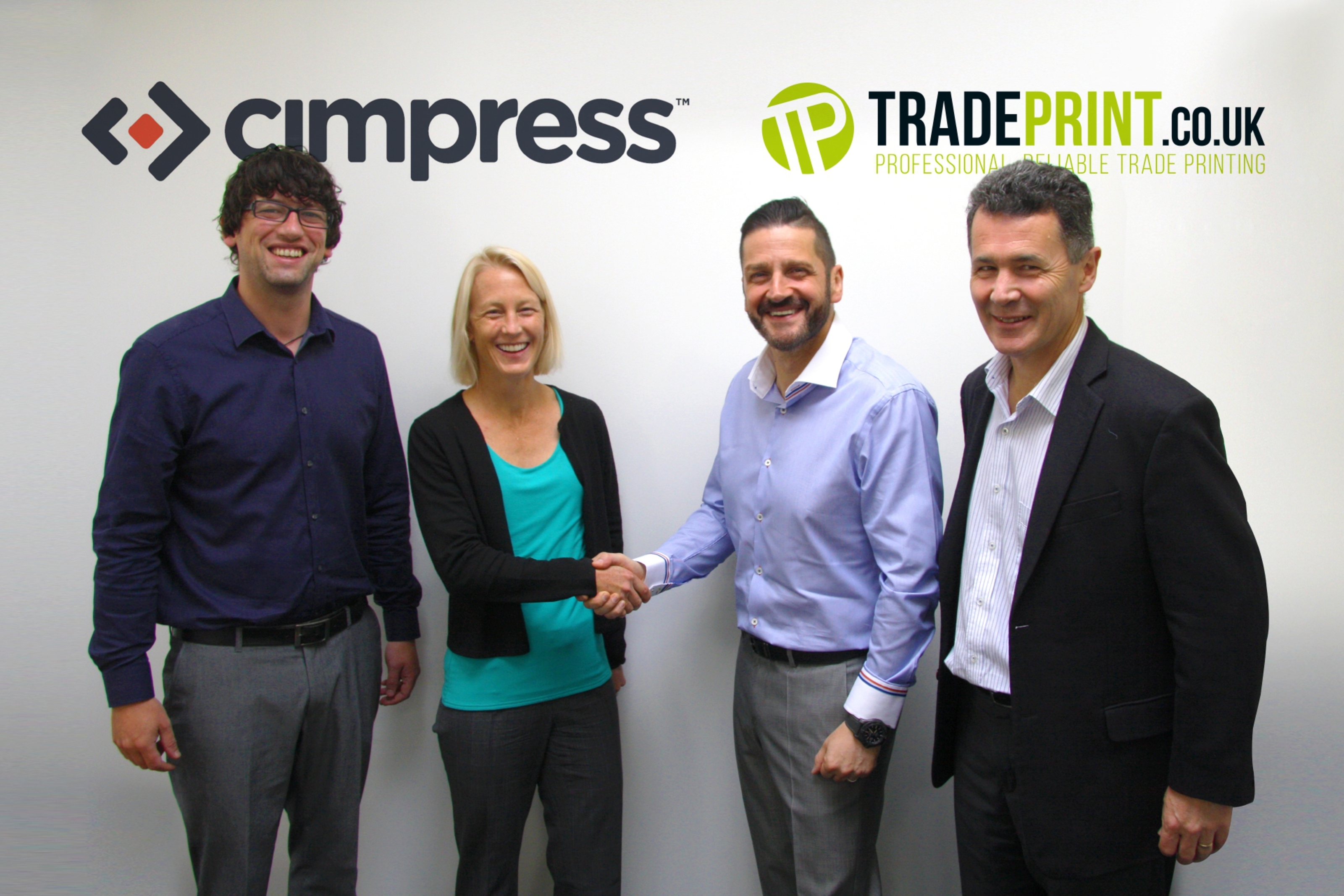 Rod Scrimgeour, former Tradeprint MD; Ashley Hubka, Cimpress VP Portfolio Management; Paul Anderson, Tradeprint owner and Bruce Hamilton, VP Portfolio Finance at Cimpress at the takeover announcement.