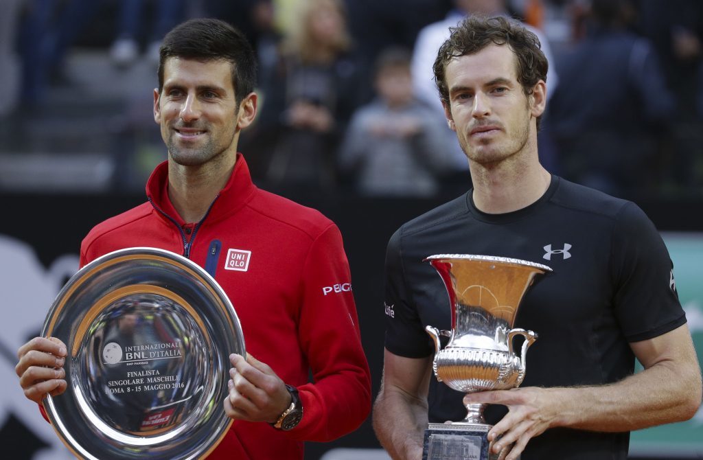 Andy Murray with the winner's trophy, alongside runner-up Novak Djokovic.