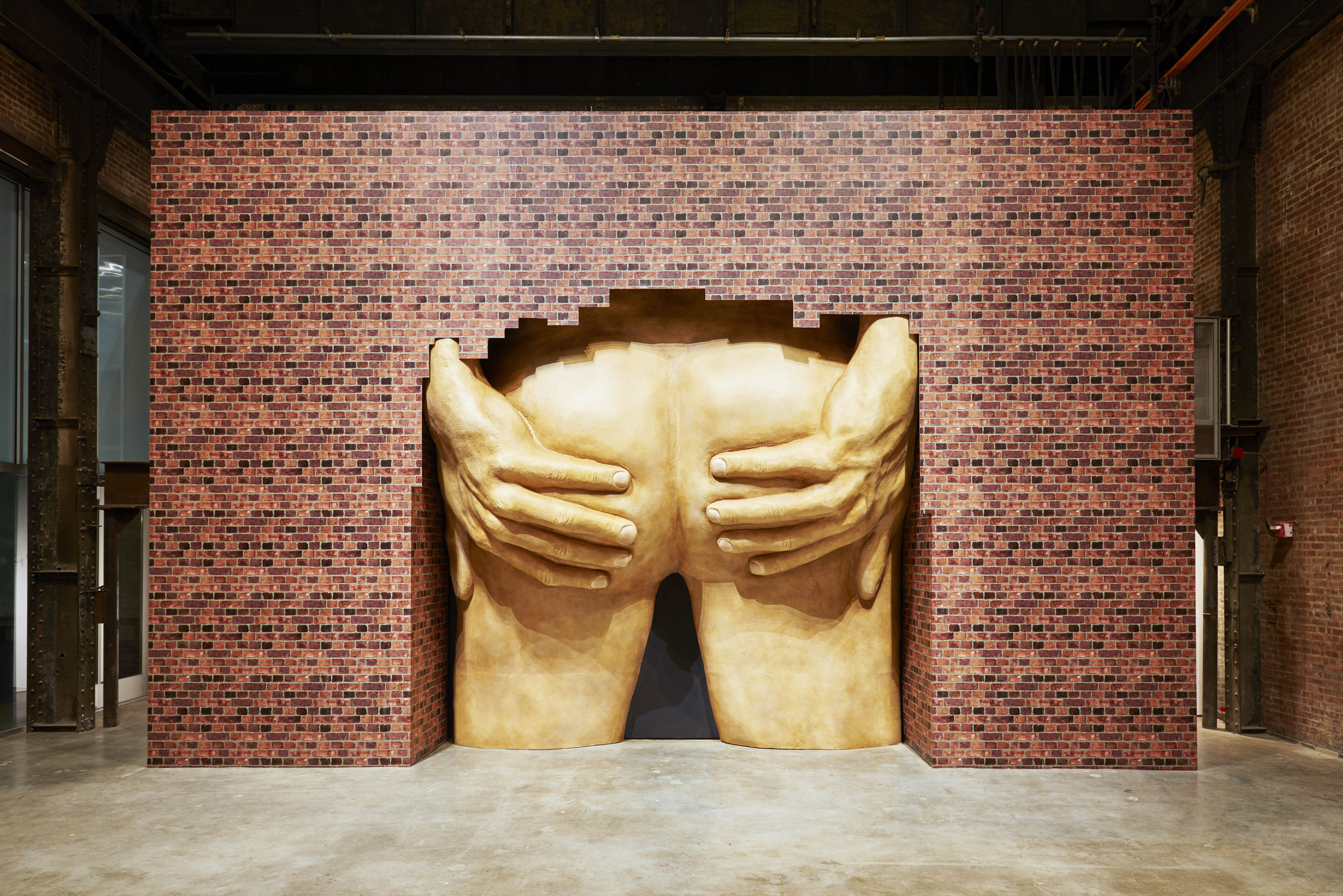 Anthea Hamilton's piece featuring a large set of buttocks apparently bursting out from behind a wall.