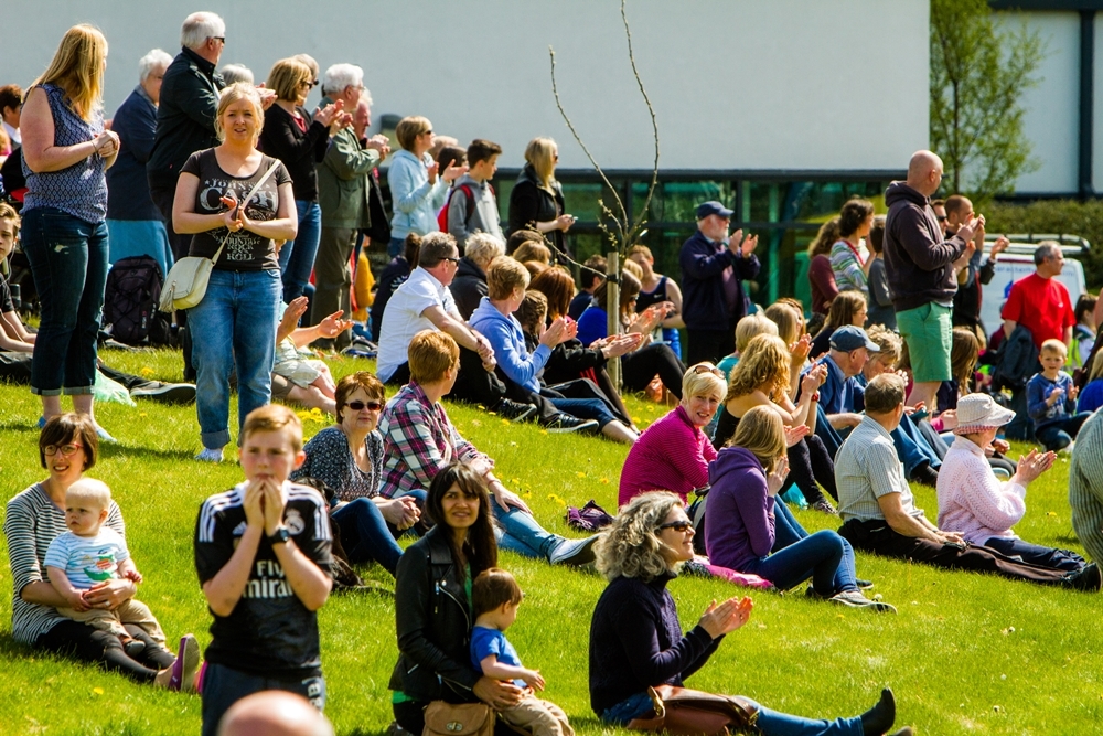 Crowds enjoying sunny weather.