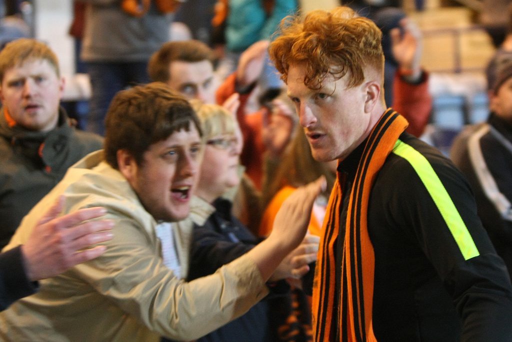 Dundee Uniteds Simon Murray is consoled by fans after being relegated from the Premiership at Dens