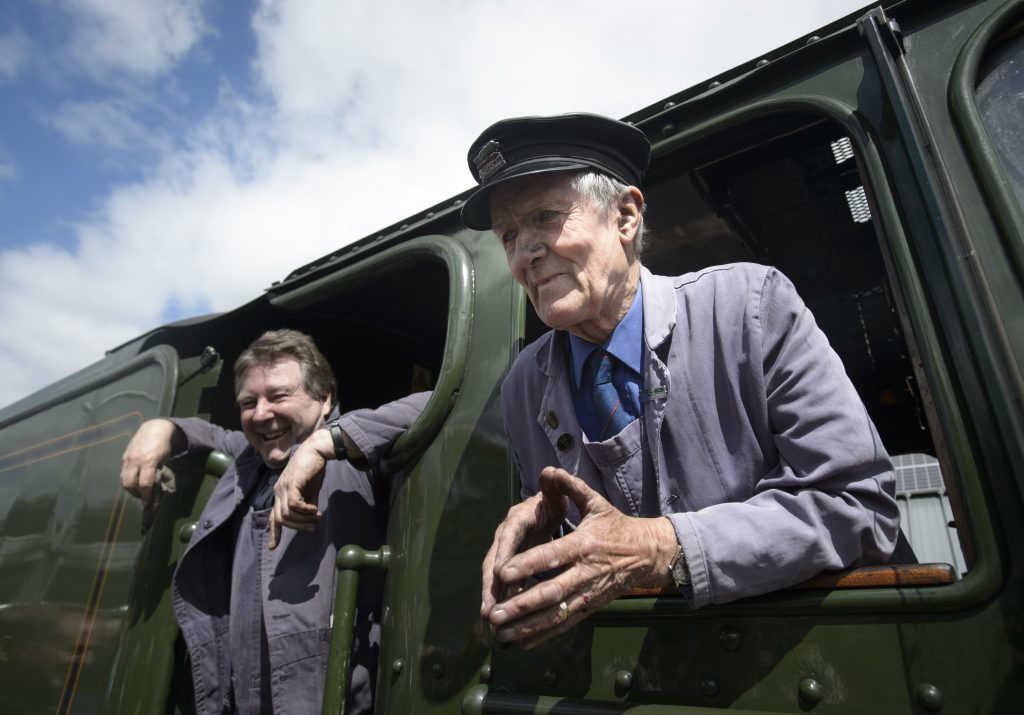 Flying Scotsman driver Steve Chipperfield (left) and engine fireman Gordon Hodgson, 77, both from Carlisle, in the engine room, as they arrive at Tweedbank railway station.