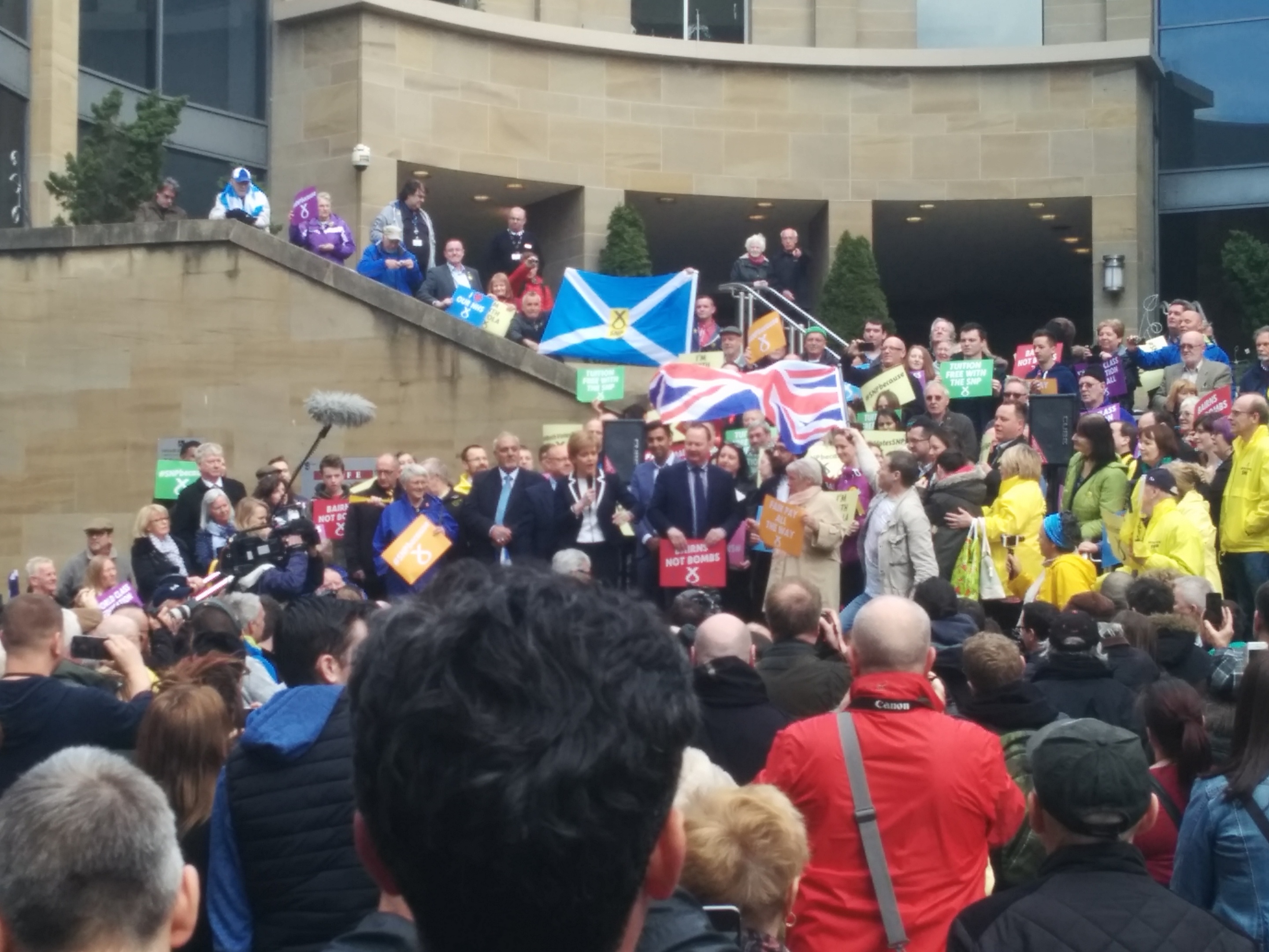 Alistair McConnachie waves his Union Flag at Nicola Sturgeon before being escorted away by police