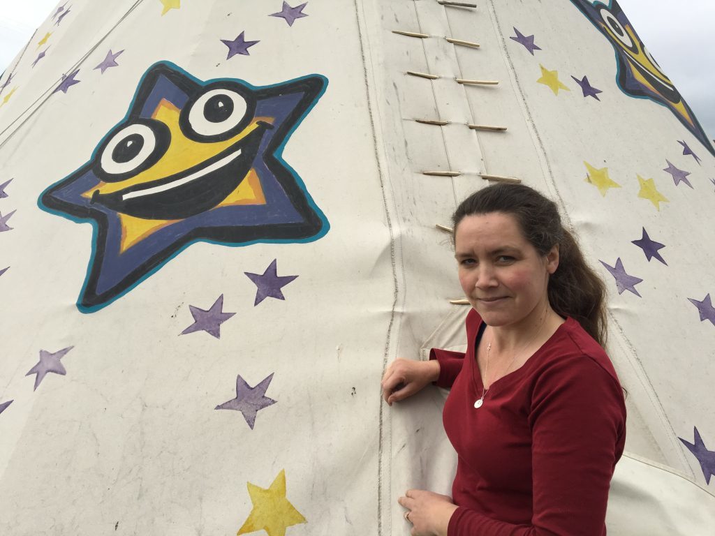 Karen Morrison, the founder of STAR, next to the wigwam where children can play and get stories