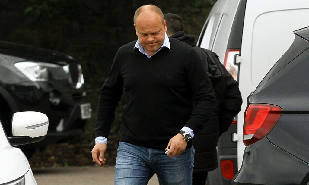 Mixu Paatelainen heads off after saying his goodbyes to the Dundee United squad.