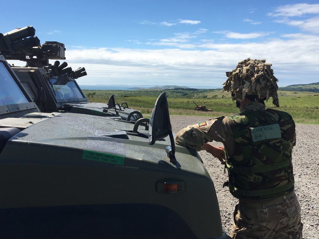 Keeping a look out from a Panther command vehicle