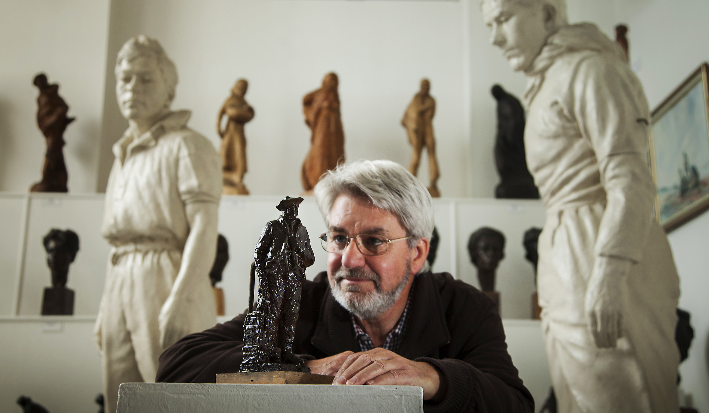 Norman Atkinson OBE with the plasticine figure, which will be stored after casting.