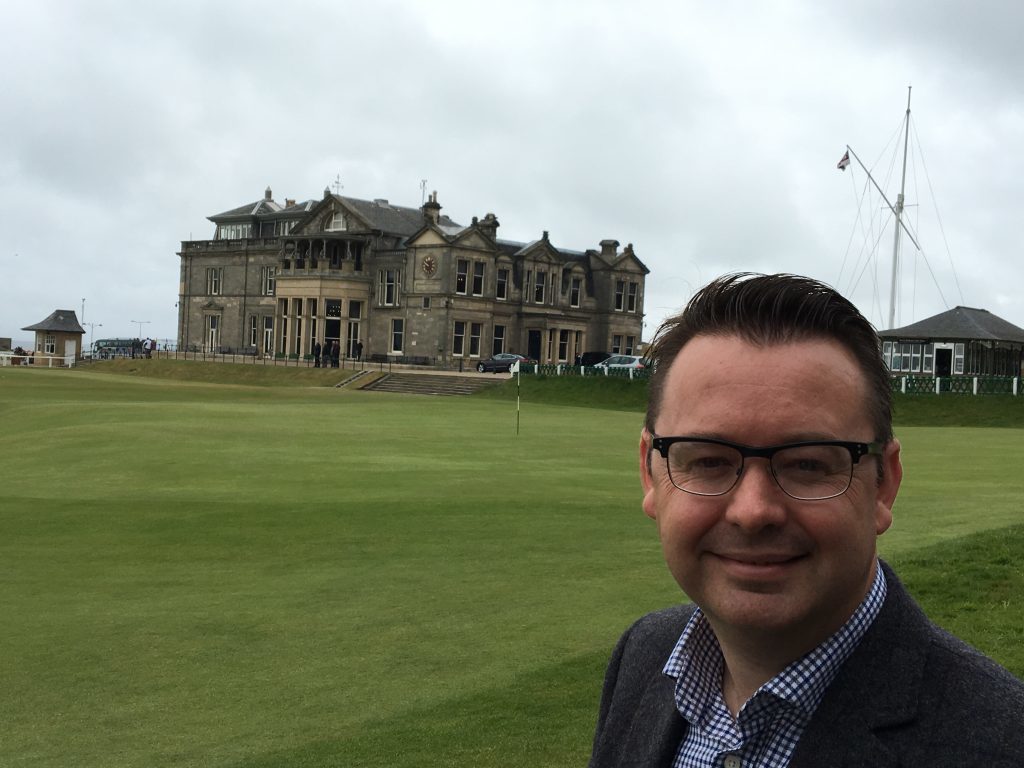 Author Roger McStravick next to the Old Course