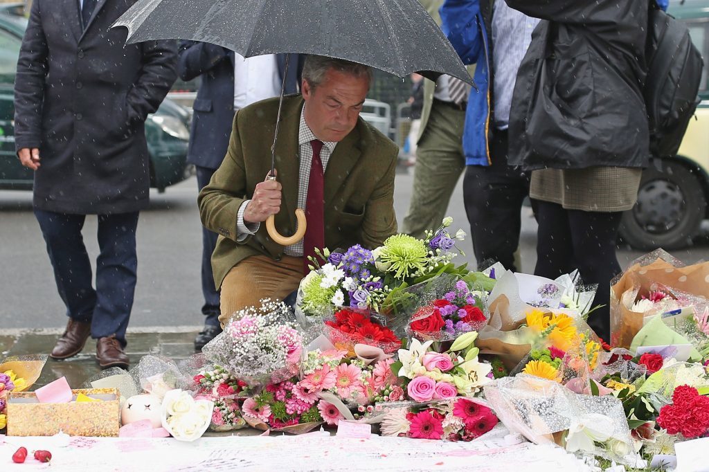 Ukip leader Nigel Farage arrives to leave a tribute to Jo Cox on Parliament Square.