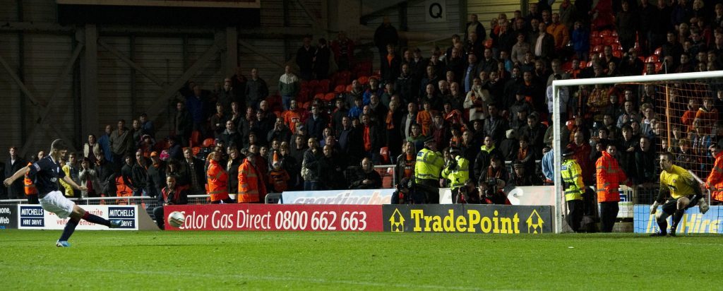 Stewart Murdoch scores the winning penalty in a shoot-out against Dundee United in the League Cup in 2011.