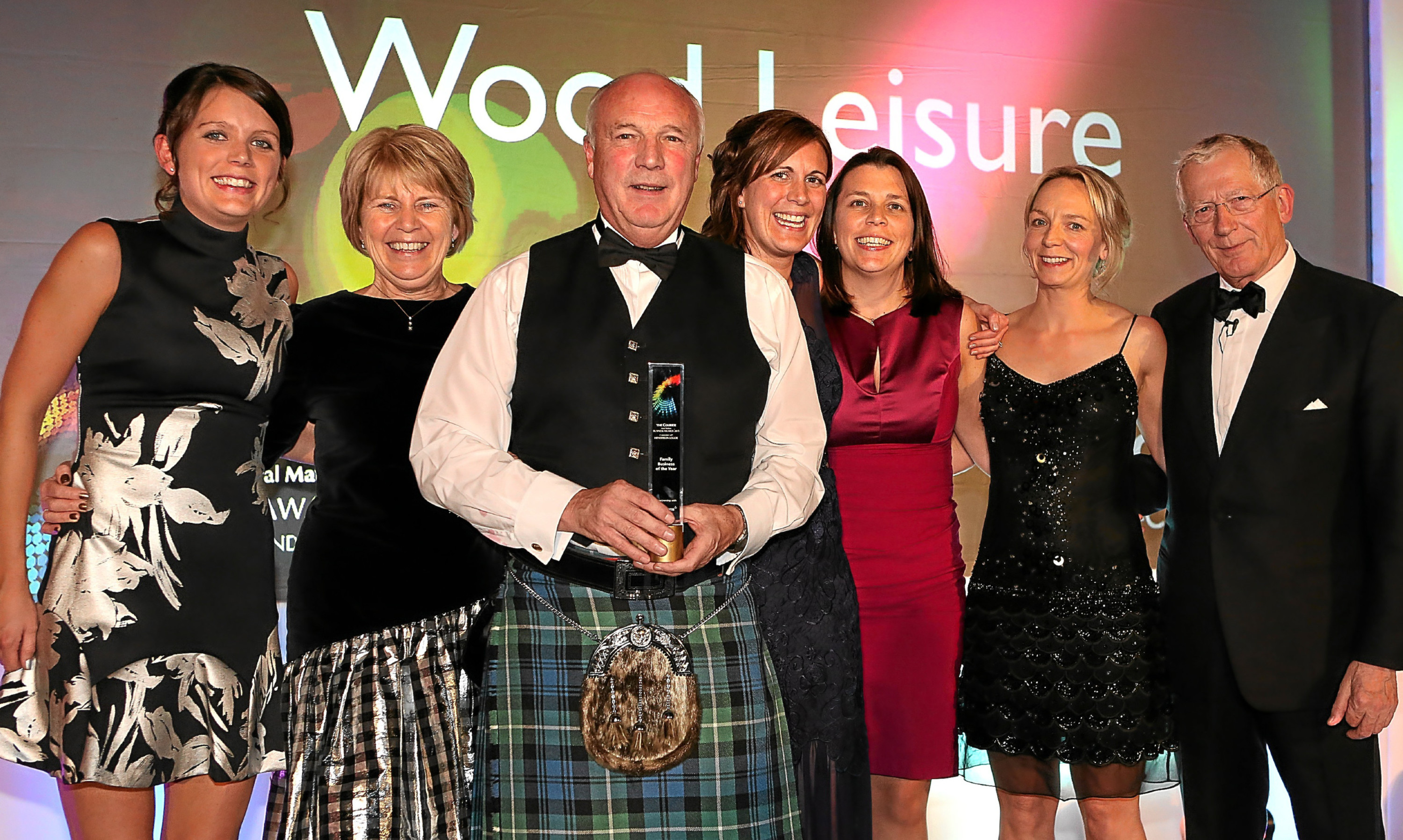 The Wood family celebrate their awards success with Lesley Larg of Thorntons and 2015 host Nick Hewer.