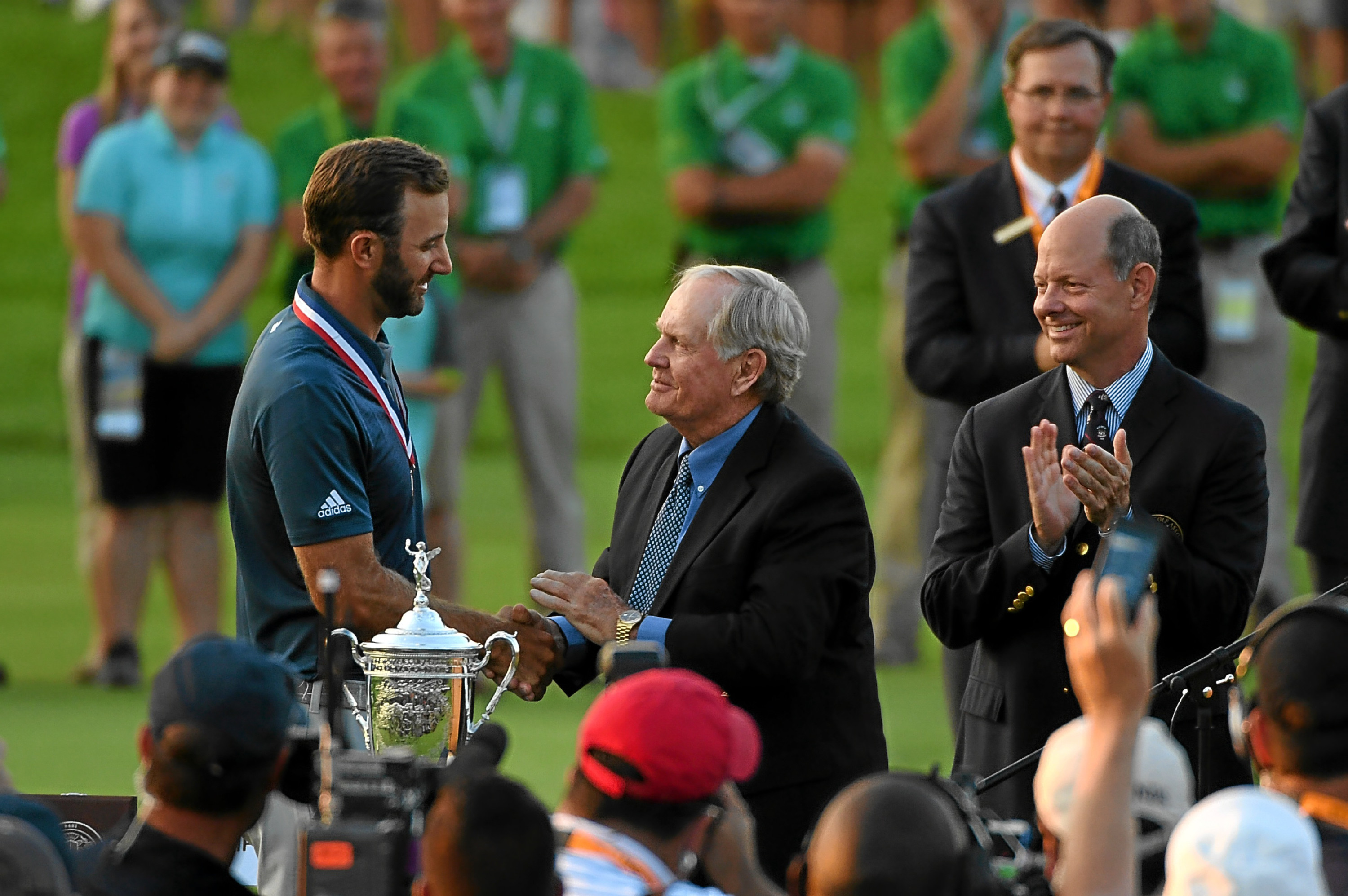 OAKMONT, PA - JUNE 19:  Dustin Johnson of the United States celebrates alongside Jack Nicklaus after winning the U.S. Open at Oakmont Country Club on June 19, 2016 in Oakmont, Pennsylvania.  (Photo by Ross Kinnaird/Getty Images)