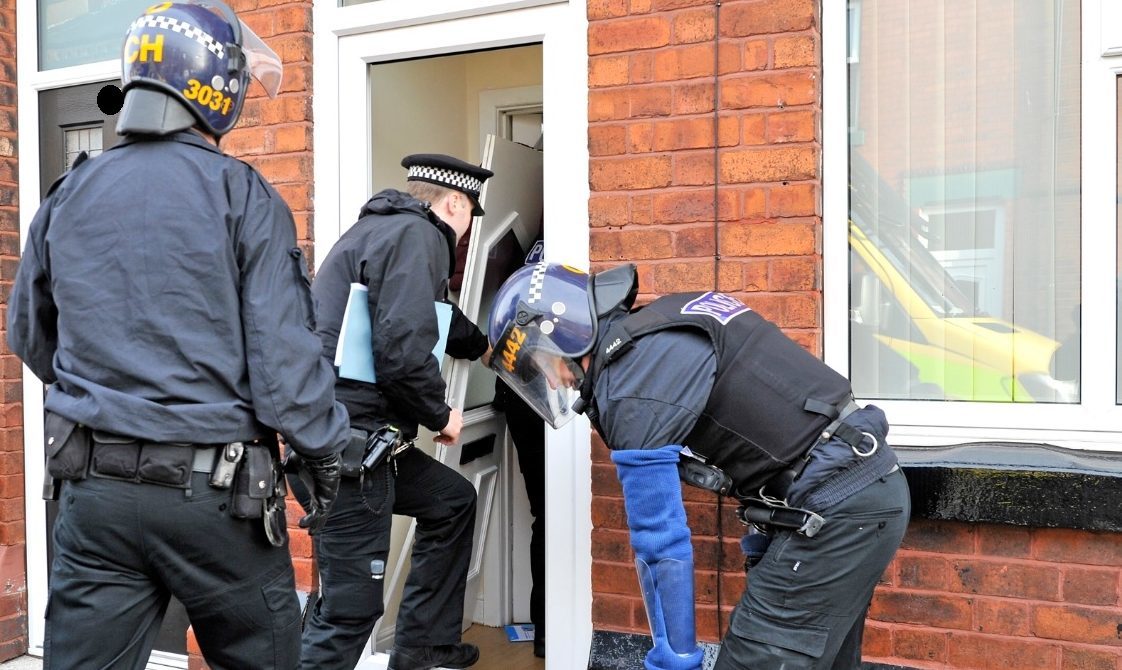 Police raid homes in Merseyside as part of ATM investigation.