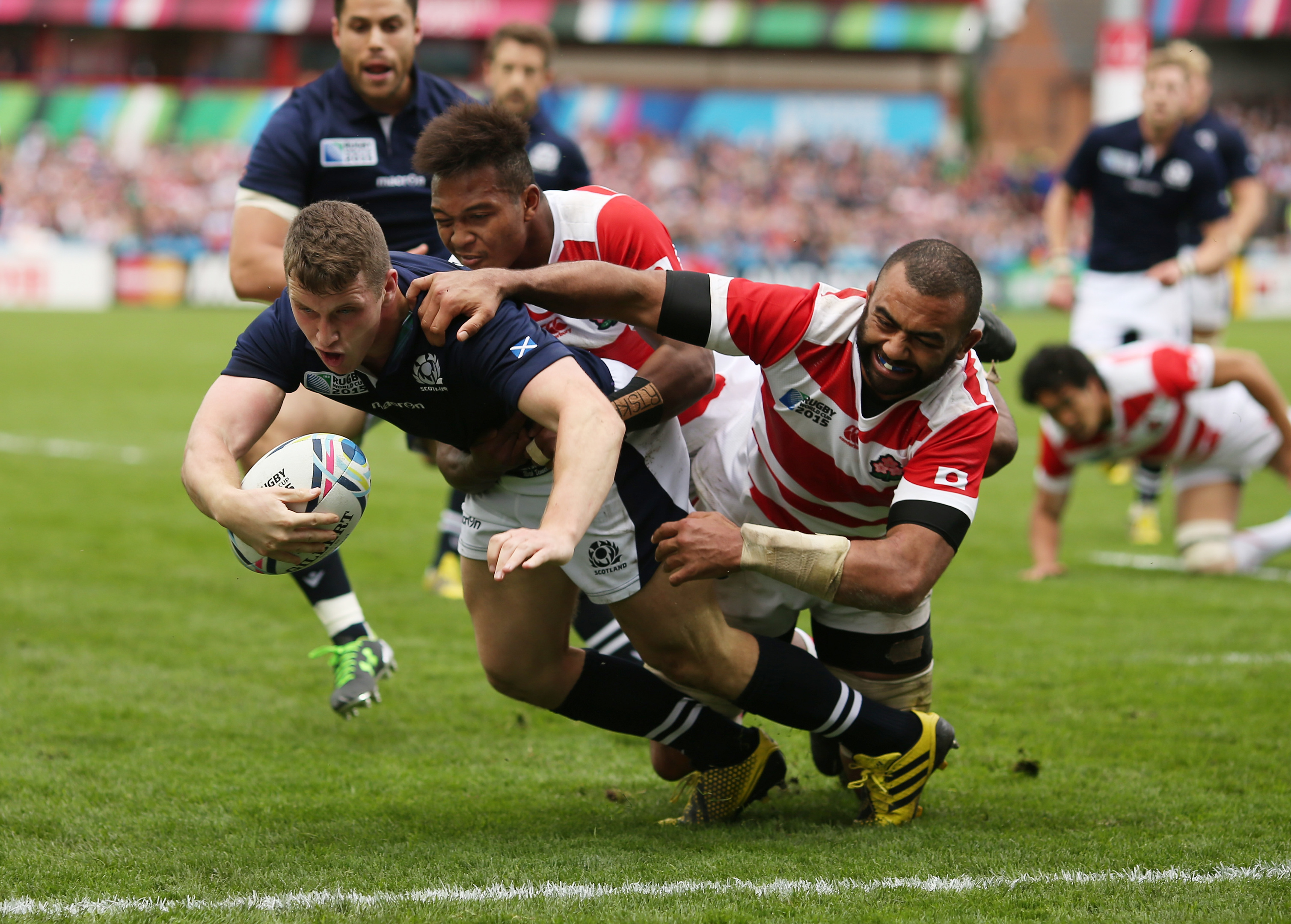 Scotland's Mark Bennett scores against Japan in the 2015 Rugby World Cup meeting at Gloucester.