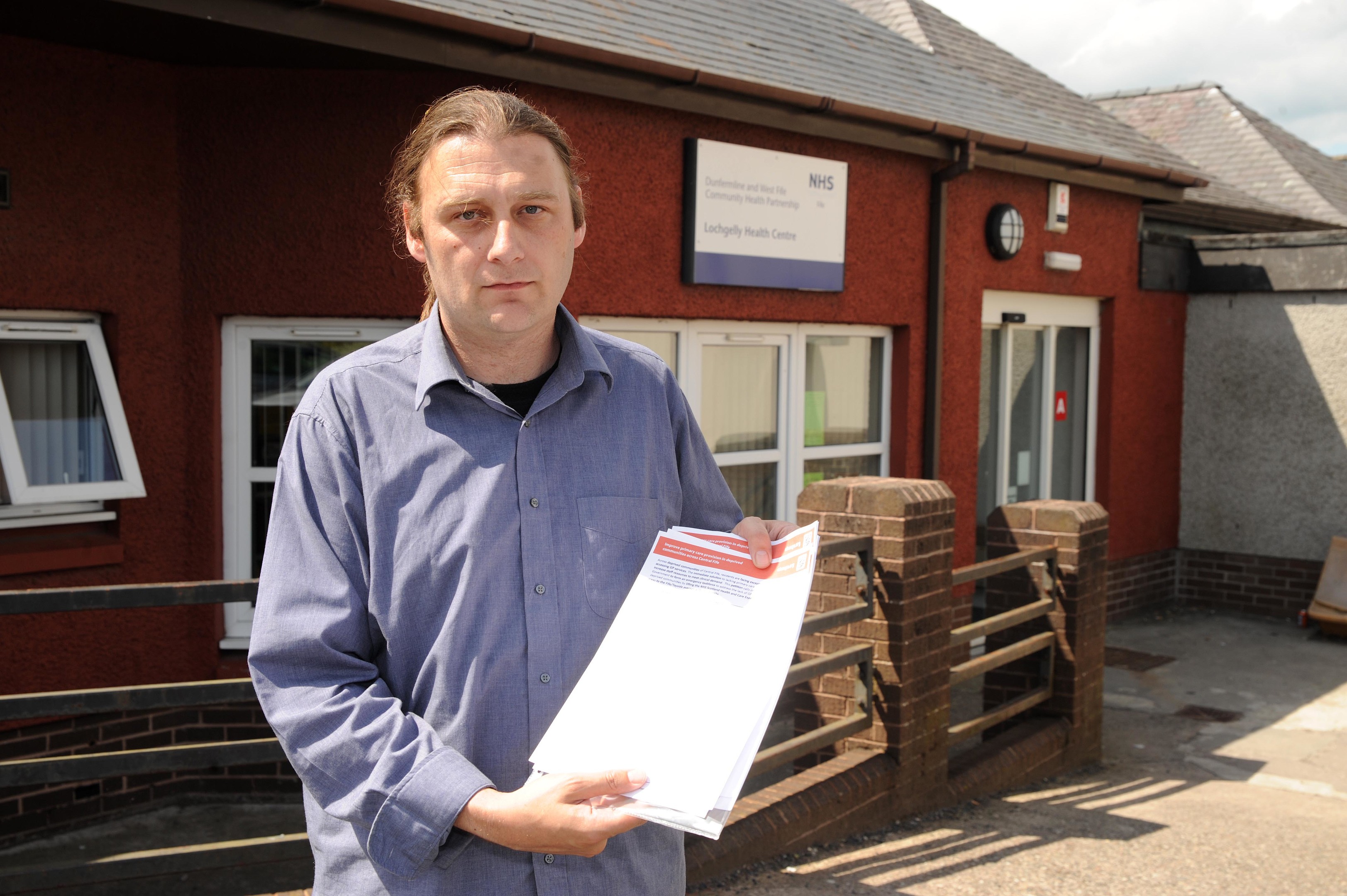 James Glen outside Lochgelly health centre with his petition