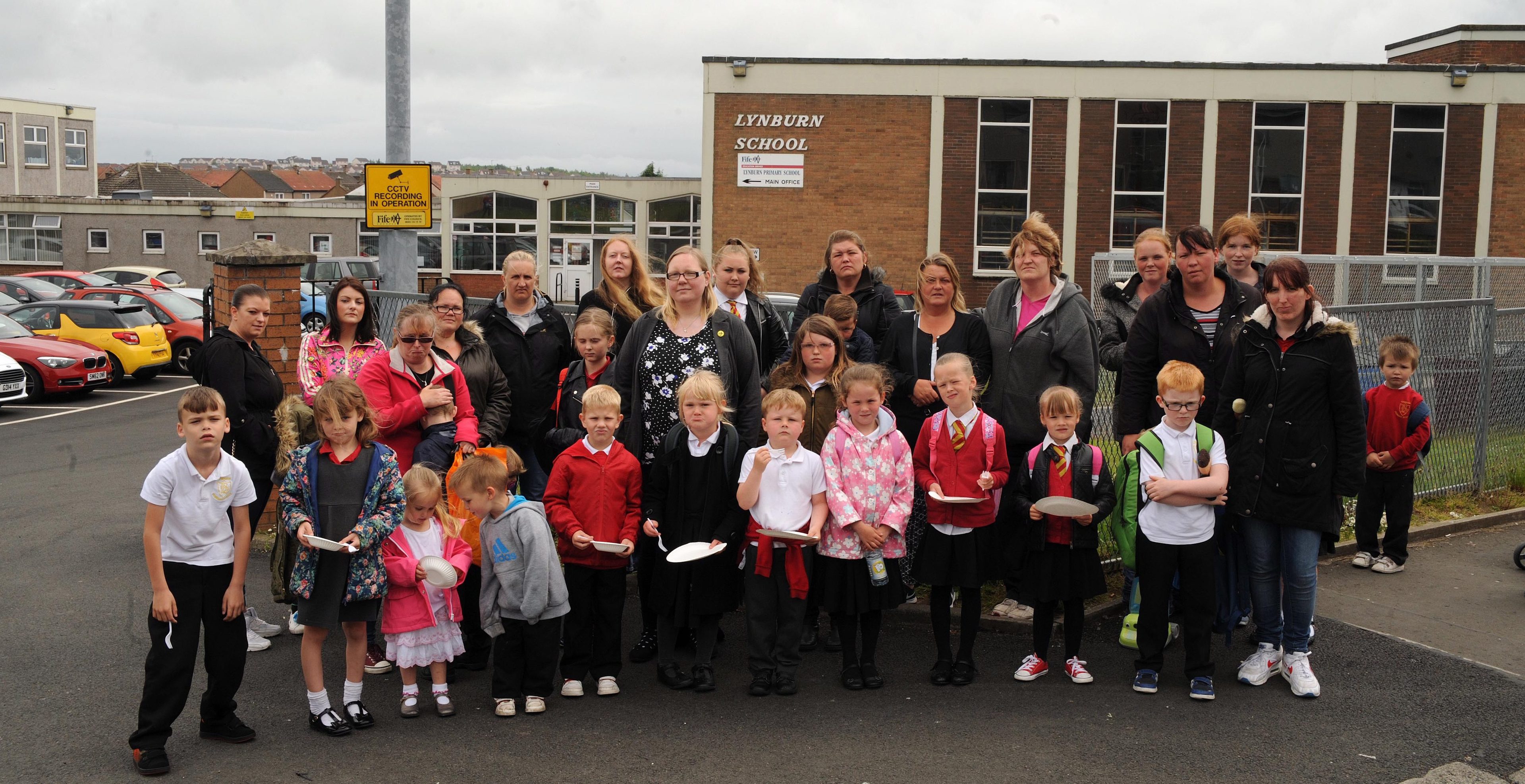 Pupils at parents join Councillor Fay Sinclair outside Lynburn primary.