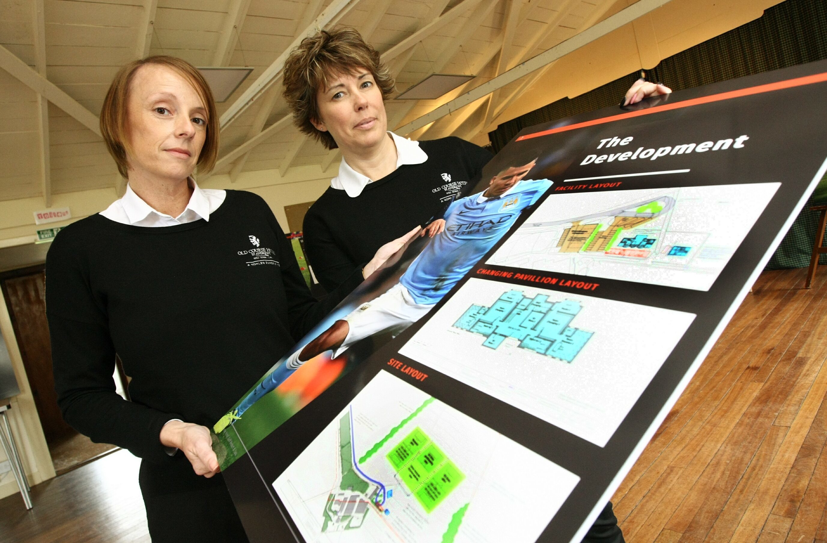 Phyllis Wilkie and Helen Parker with the development plans.