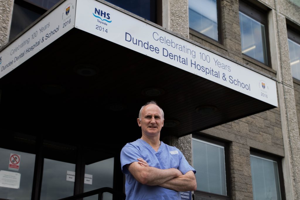 Professor Paul Mossey outside the Dundee Dental School and Hospital