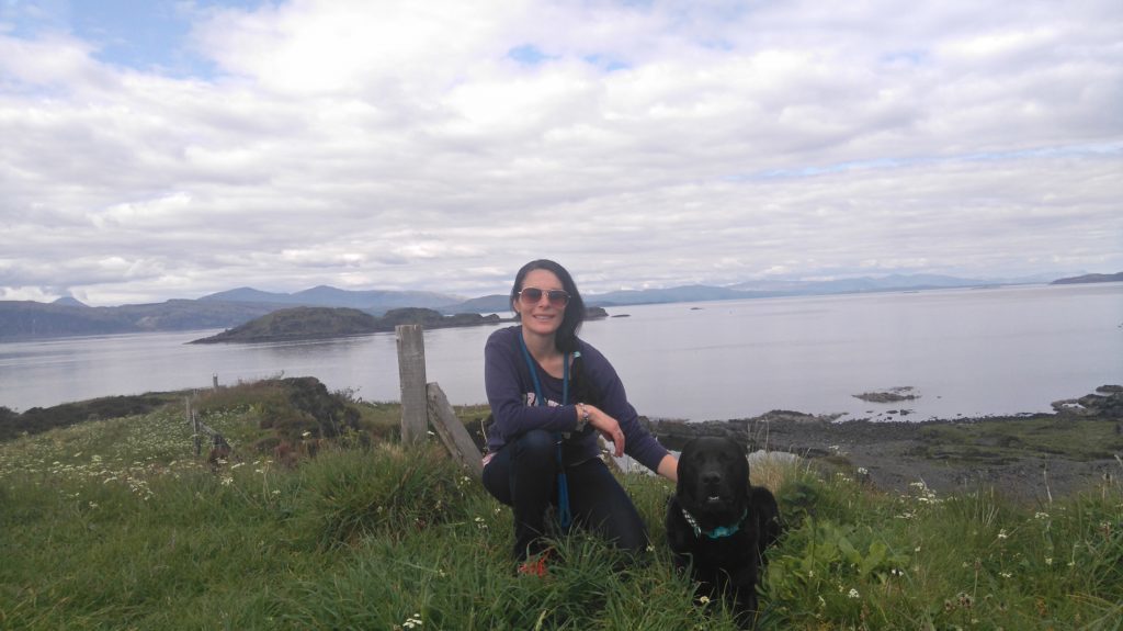Gayle and Toby enjoy the views from Easdale Island's highest point.