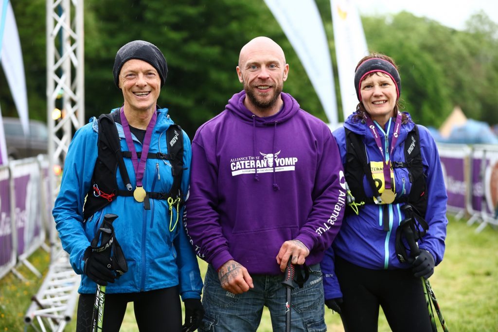 Race patron Mickey Yule with third-place finishers Tim and Jackie Heilbronn.