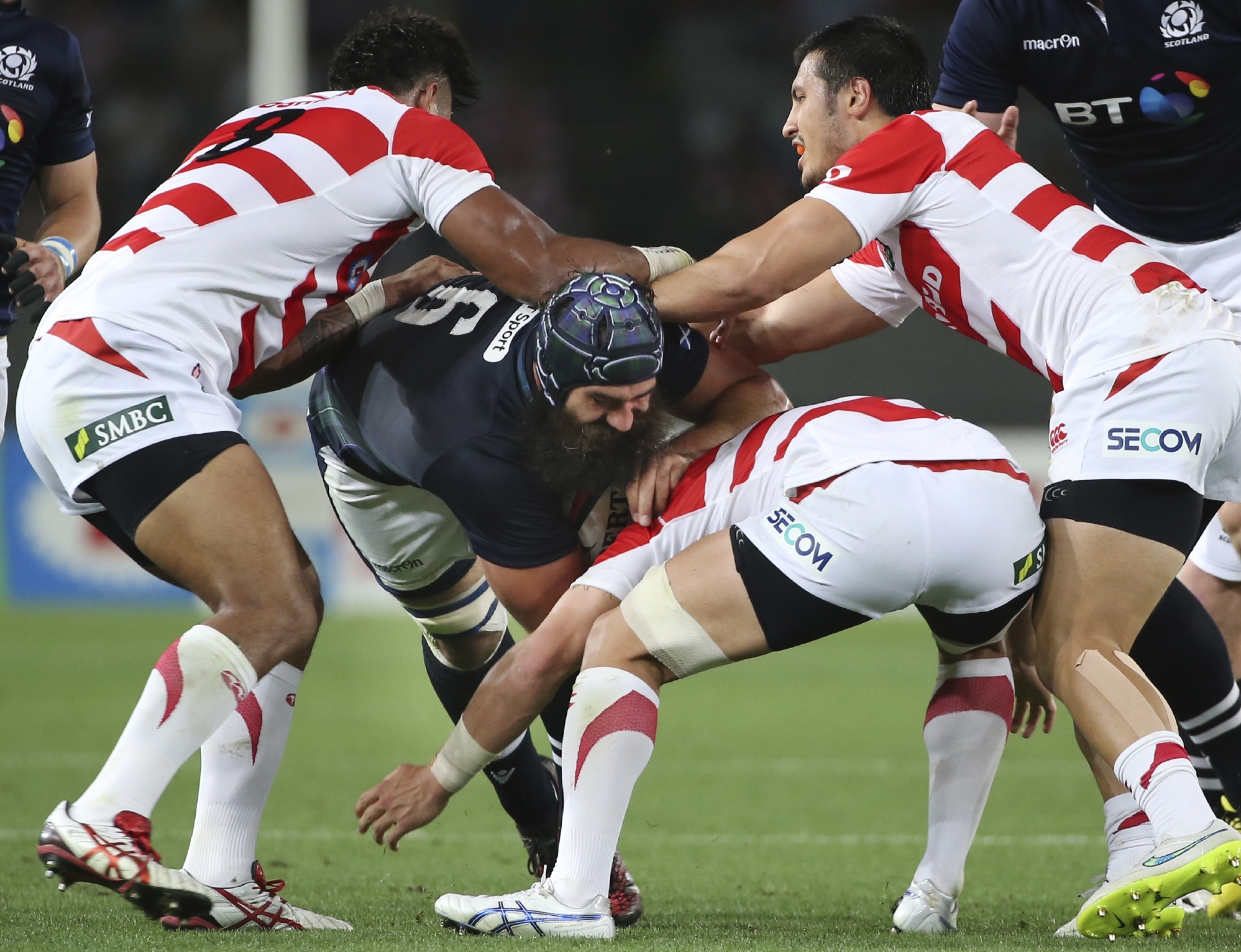 Josh Strauss tries to power a way through Japan's defence in the second test.