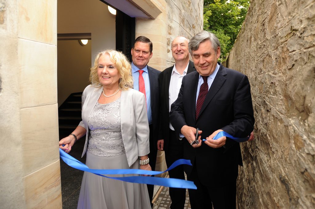 Cutting the ribbon to mark the event - l to r - Marilyn Livingstone (Chief Executive, Adam Smith Global Foundation), Michael Levack (Chairman, Adam Smith Global Foundation), Councillor Neil Crooks and Gordon Brown.
