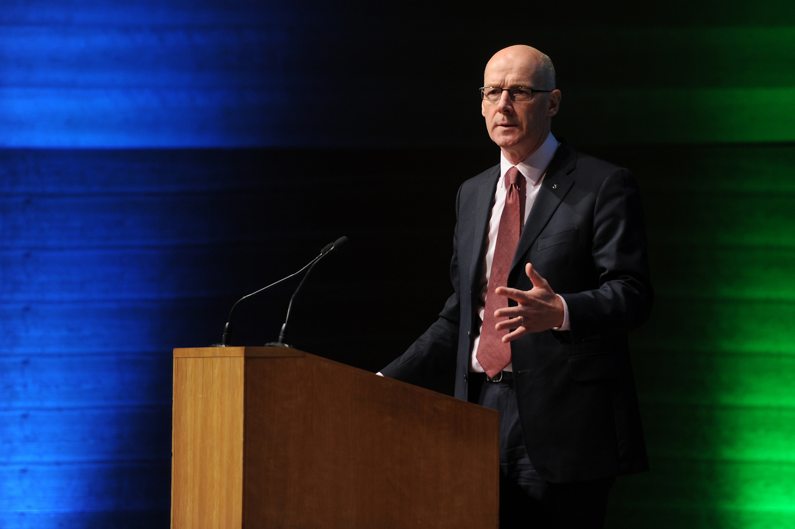 John Swinney addresses the summit at Perth Concert Hall.