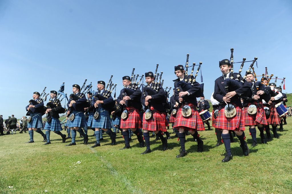 The massed pipes and drums perform in the display area.