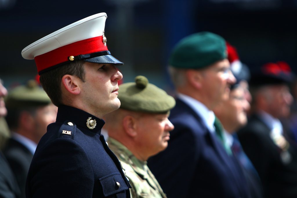 Courier News - ArmedForcesDay - FlagRaising - Forfar - Angus. Armed Forces Day. Town and County Hall. HM Lord Lieutenant, the Provost of Angus and past, present and future servicemen and women will muster behind the Town Hall on the north side and march, in order, a short distance to the south side at The Cross. The march will be coordinated by members of The Royal British Legion (Scotland) Forfar Branch and marching with Standard Bearers and Queens Colours following a lone Piper.  Once in position and at 10.30 the Bugler will sound at which point the commissioned AFD flag will be raised. Picture shows; Royal Marines and other military/veterans on parade, Monday 20 June 2016.