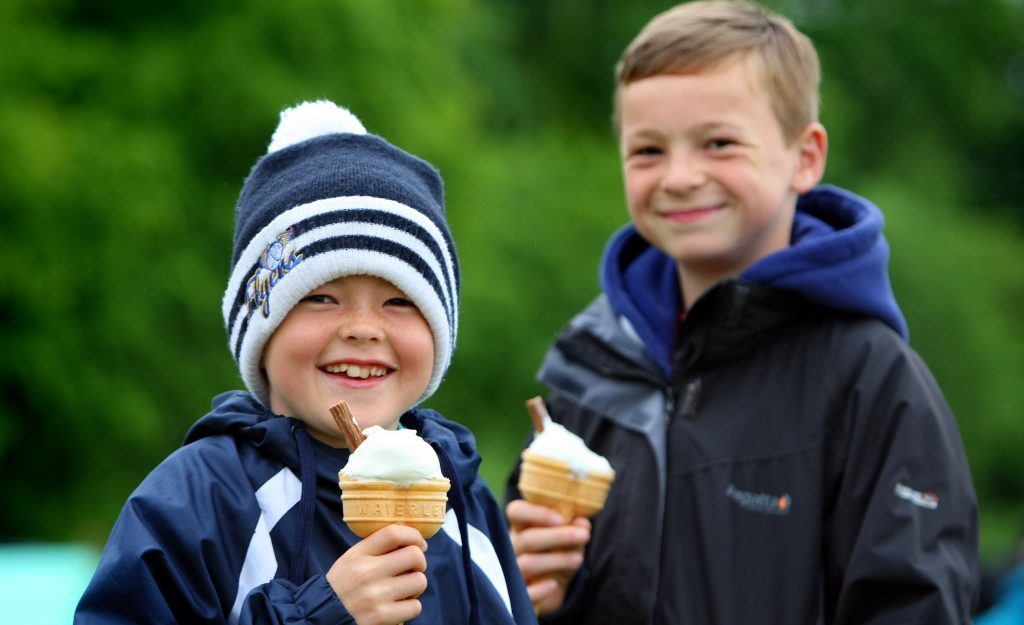 Aidan and Billy Howie enjoyed the ice cream at Cupar Highland Games despite the cool conditions.