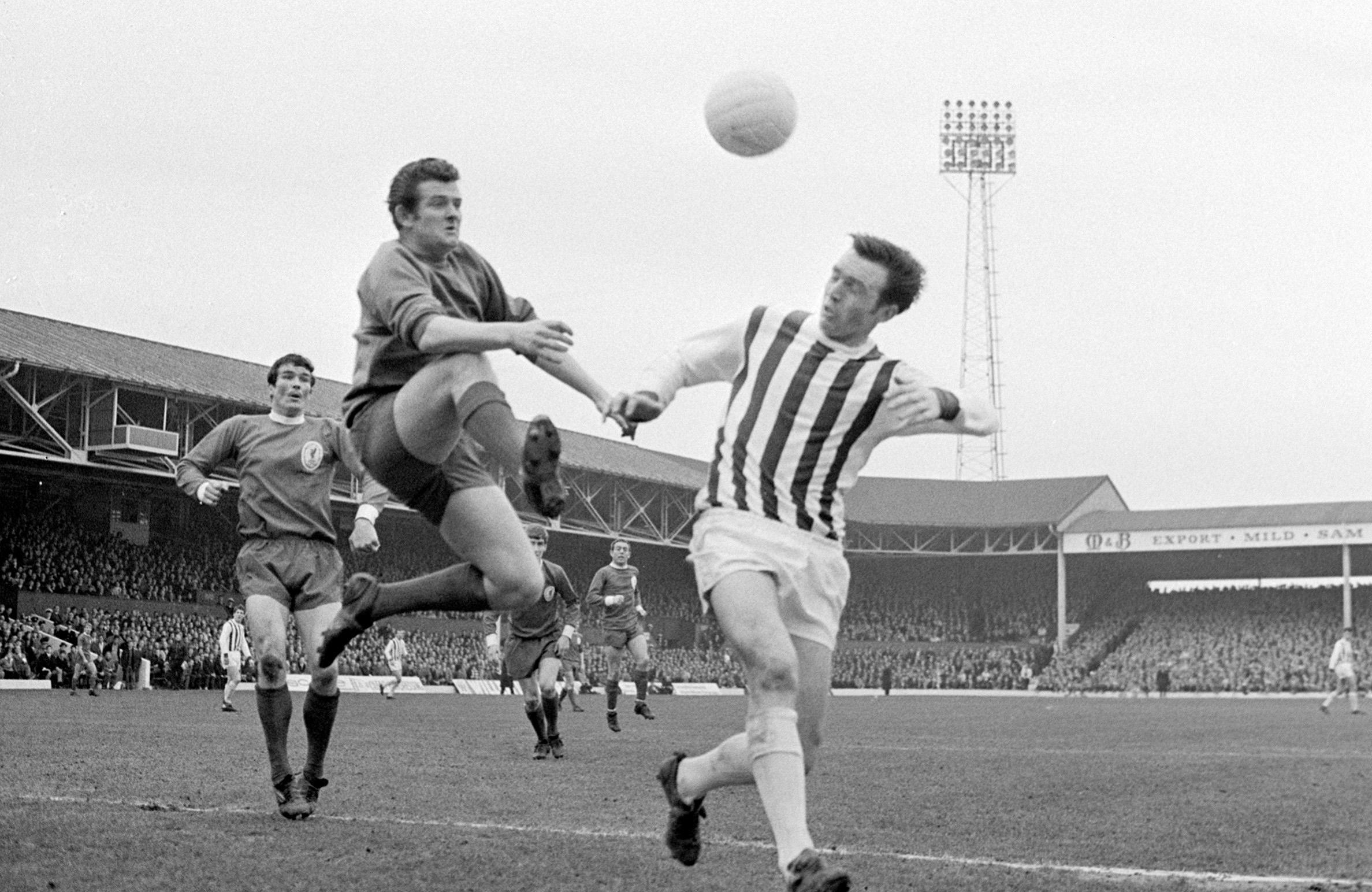 Jeff Astle in an aerial challenge with Tommy Lawrence, the former Liverpool goalkeeper.