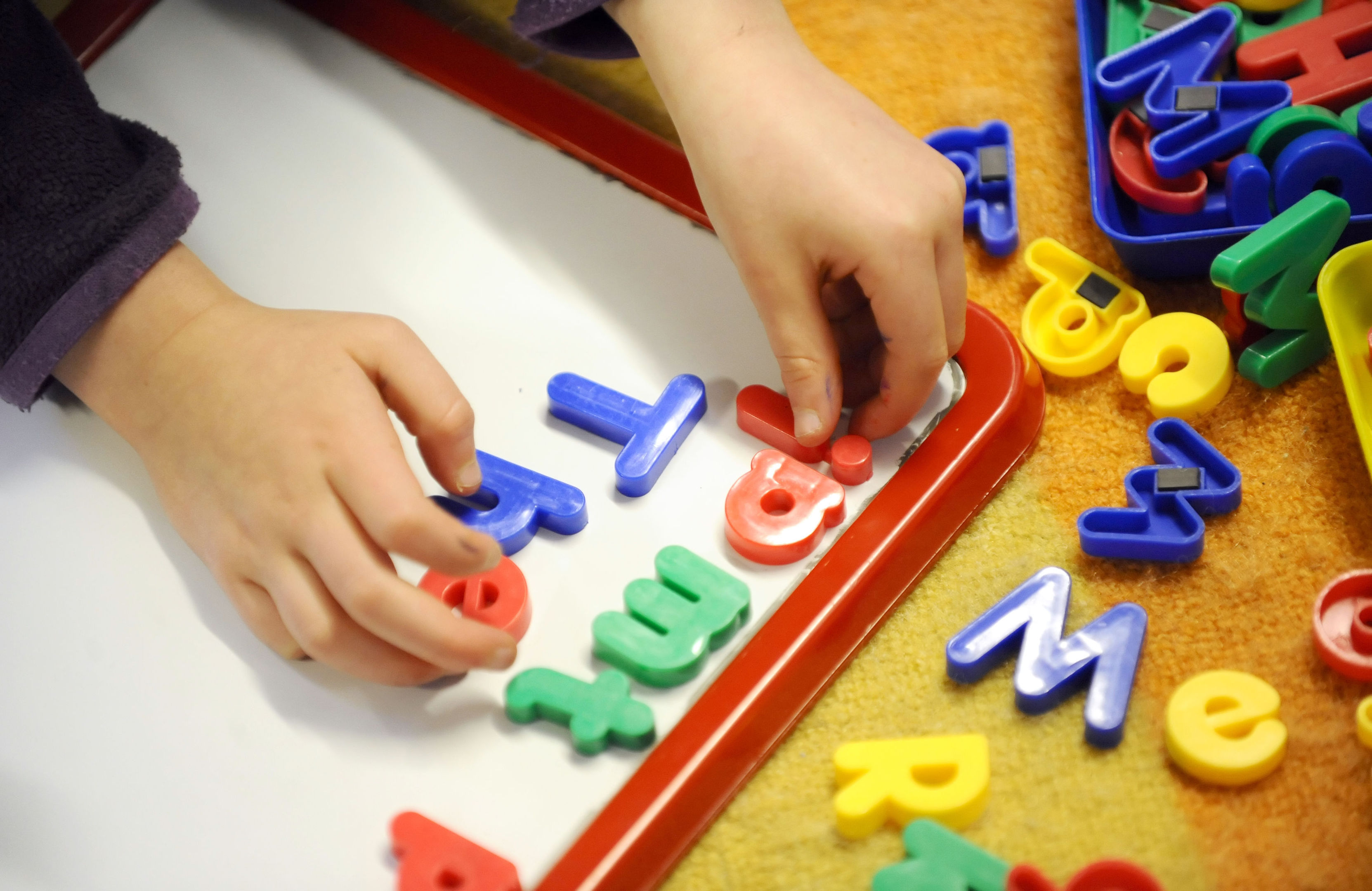 A regulator boss has accused the Scottish Government of undervaluing the childcare profession.