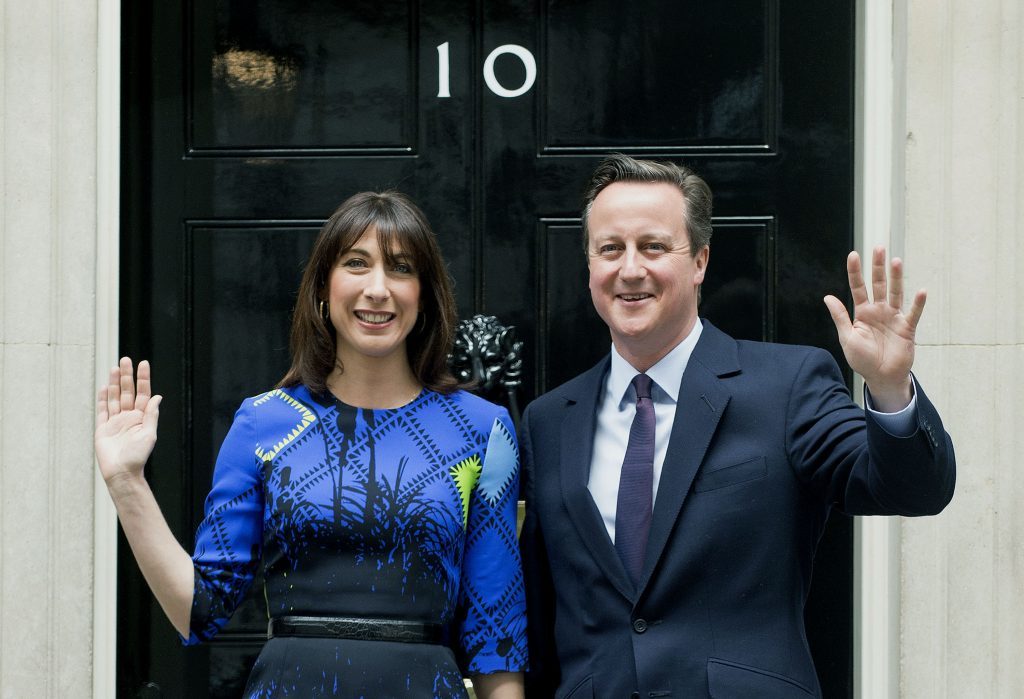Prime Minister David Cameron arrives at 10 Downing Street, London, with his wife Samantha, following an audience with Queen Elizabeth II at Buckingham Palace, to confirm his second term as Prime Minister following his party's General Election victory.