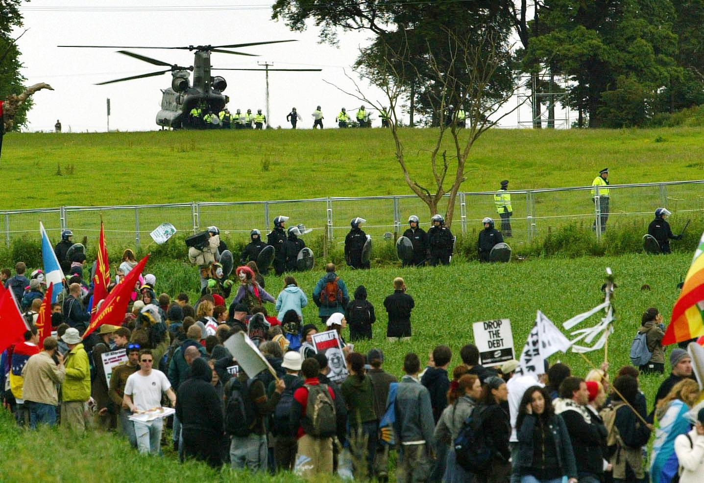 Police reinforcements are drafted in by helicopter, after protestors breached the security fence at Auchterarder during the G8 summit at Gleneagles in 2005.