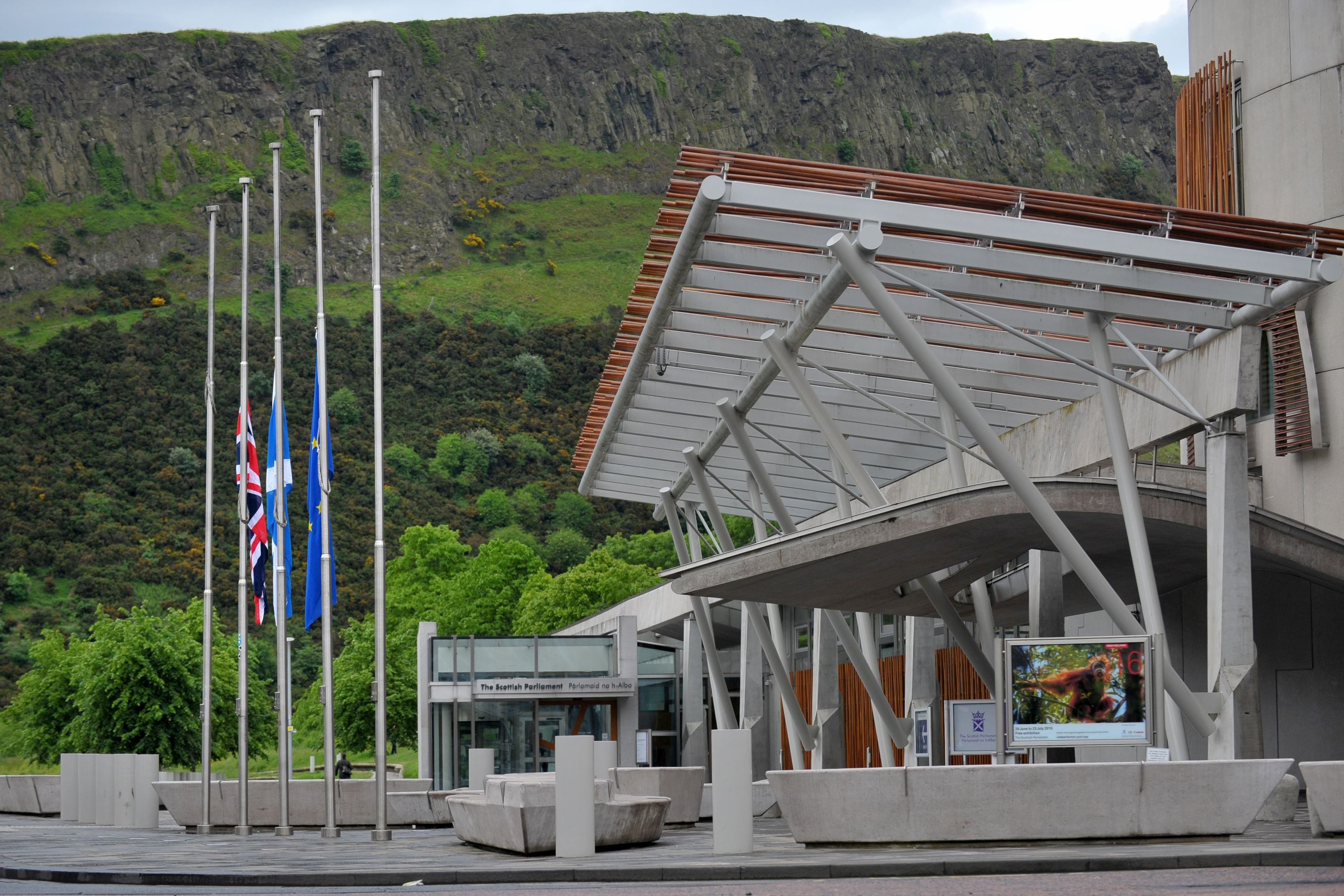 Flags at half mast outside Scottish Parliament after Labour MP Jo Cox was shot and stabbed to death in the street outside her constituency advice surgery in Birstall, West Yorkshire.